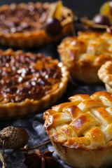 Background with various mini muffin pies / Thanksgiving desserts frame
