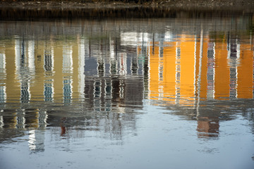 Colorful buildings reflected in the water