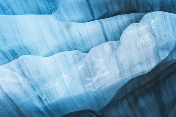 Close-up the ceiling of an ice grotto in a crumbling glacier. Textured background. Global warming. Small DOF
