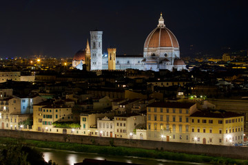Fototapeta na wymiar Night view of The Florence Cathedral, Duomo di Firenze, Cattedrale di Santa Maria del Fiore and the Lungarno in Florence Italy