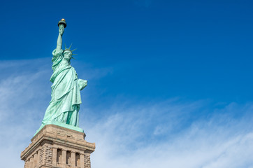 Obraz na płótnie Canvas Statue of Liberty against blue sky in New York City