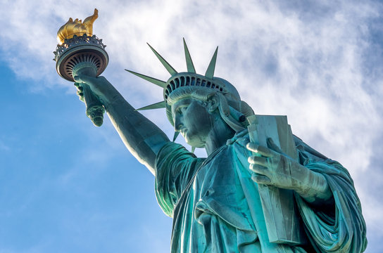 Fototapeta Statue of Liberty against  blue sky in New York City