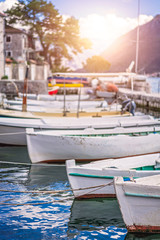Fototapeta na wymiar Anchored fishing boats in Kotor Bay in Perast