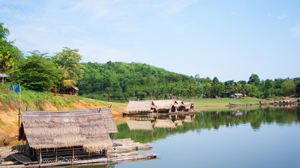 bamboo Houseboat raft floating on river for relax time landscape nature mountain background 