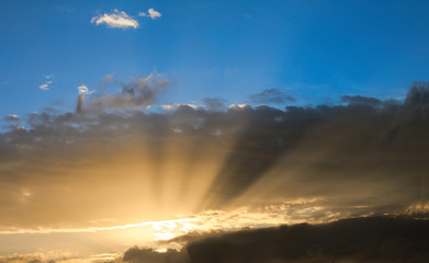 Natural Sun ray throughout cloud on blue sky