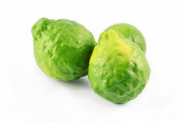 Kaffir bergamot isolated / fresh green Kaffir fruit isolated on white background - three of green bergamot tropical fruit for food and nature herb 