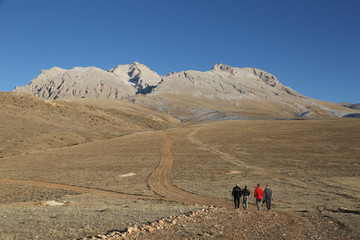 Fototapeta na wymiar Mountaineers trekking at Aladaglar National Park in Nigde, Turkey. Aladaglar is most important mountain range in Turkey.