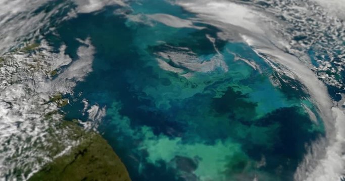 Very high-altitude circular tracking shot of clouds over the Barents Sea, with tilt-shift effect. Reversible, seamless loop. Elements of this image furnished by NASA. 