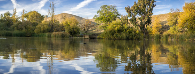 Panoramic view of the pond in Garin Dry Creek Pioneer Regional Park at sunset, San Francisco bay, California