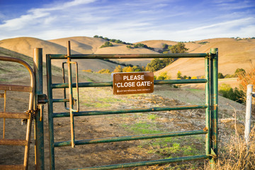 Cattle gate on one of the hiking trails in Garin Dry creek  Pioneer Regional Park in east San Francisco bay, California