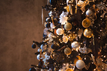Christmas background, Stylish Christmas tree the black and gold colors. Soft image