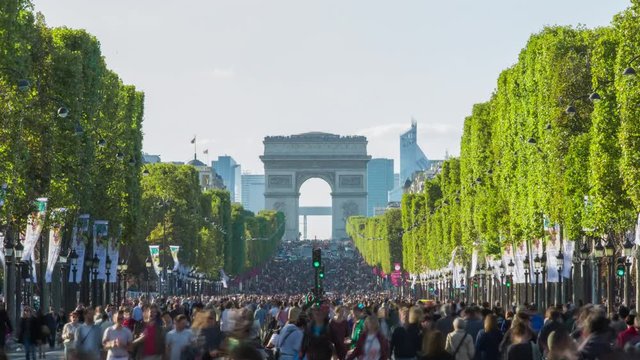 Main street of Paris, Champs elysees on a sunny day with no cars in the streets.  Zooming timelapse