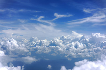 blue sky with white clouds from airplane