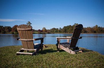 Adirondack Chairs Next to a Lake in the Autumn