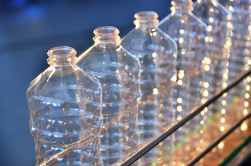 Bottle. Industrial production of plastic pet bottles. Factory line for manufacturing polyethylene...