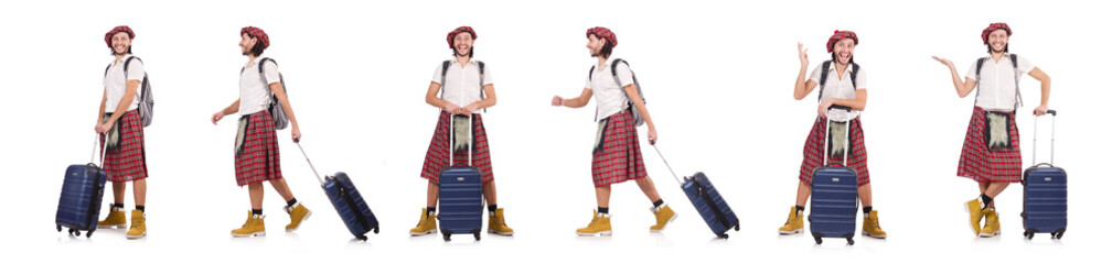 Man in scottish skirt with suitcase isolated on white
