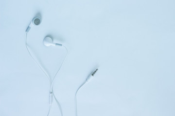 earbuds or earphones top view on white background
