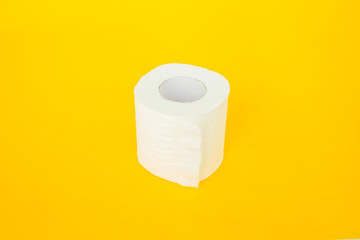 toilet paper on yellow background.