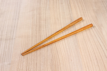 chopsticks wooden on wooden background.
