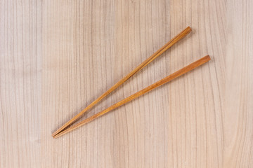 chopsticks wooden on wooden top view background.