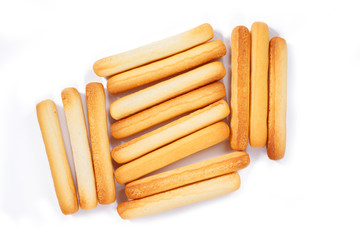 bread sticks top view on white background.