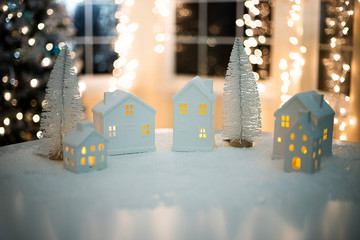 Ceramic tea light holder small houses Christmas background
