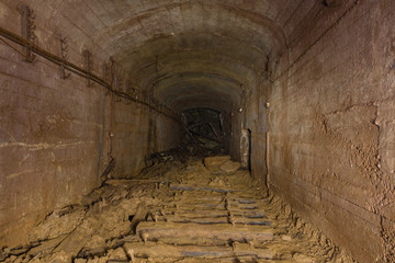 Fototapeta na wymiar Underground abandoned gold iron ore mine shaft tunnel gallery passage bunker shelter