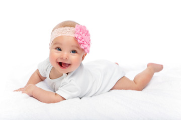 happy beautiful baby girl in white body suit