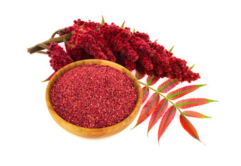 Dry Ground Sumac Spice with Drupe and Leaves. Isolated on White Background.