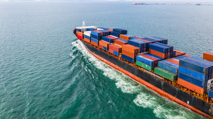 Aerial view cargo container ship sailing, container cargo ship in import export and business...