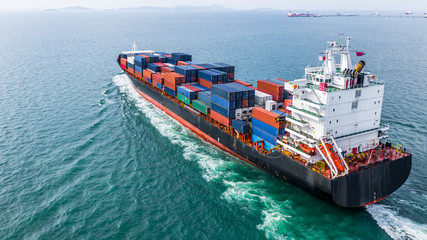 Aerial view cargo container ship sailing, container cargo ship in import export and business logistic and transportation of international by container ship, view from above business background. - obrazy, fototapety, plakaty