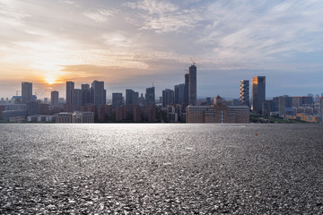 Panoramic skyline and modern buildings with empty road