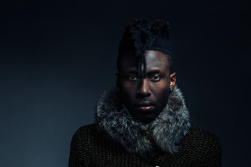 Studio portrait of male African American looking straight at camera