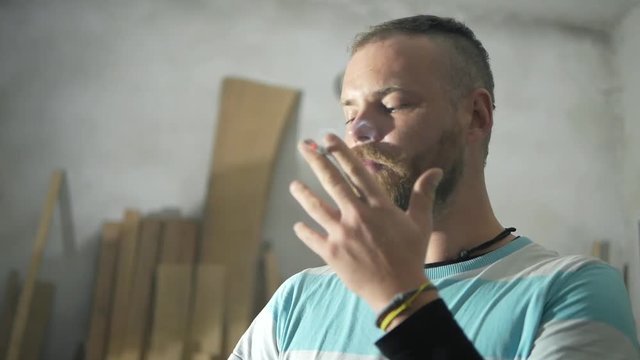 bearded carpenter smoking, smoking bearded man