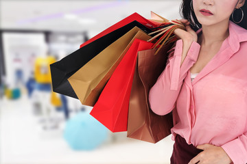 woman holding shopping bag at mall