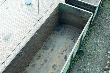 Empty rail cars on the tracks.