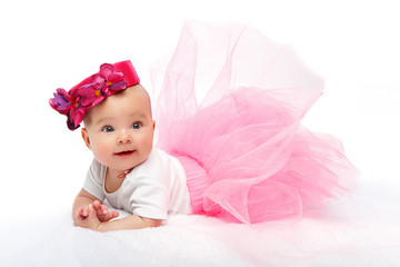 happy beautiful baby girl with pink hat on head