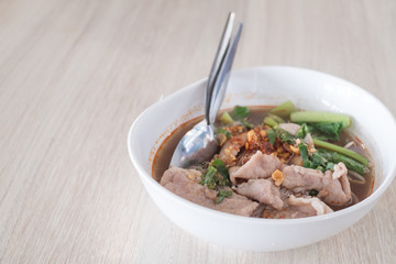 pork noodle on wood table