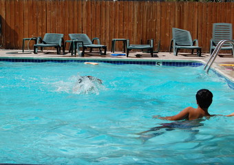 Diving and splashing in swimming pool