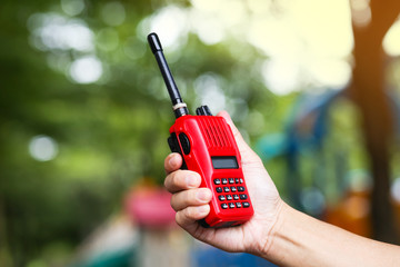 Red radio communication or handheld walkie-talkie.