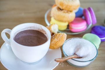 sugar addiction concept with unhealthy sweet drink and many desserts on wooden table 