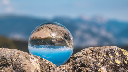Fototapeta na wymiar Crystal ball alpine landscape shot at Fuegen - Tyrol - Austria