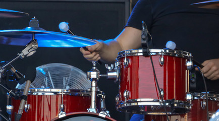 Fototapeta na wymiar Man playing drums on stage