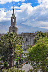 Arequipa, Peru - October 7, 2018: The Plaza de Armas and Arequipa Cathedral with the backdrop of El Misti volcano