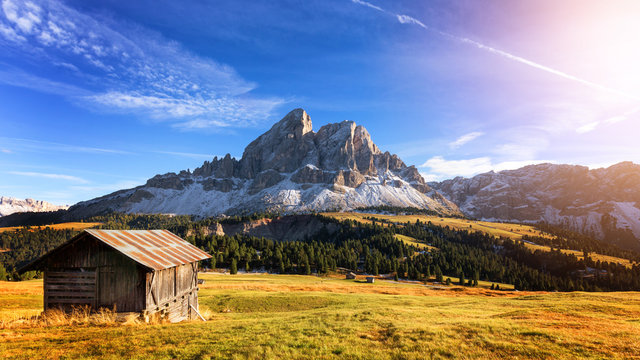 Fototapeta Mountain hut with beautiful peak on the background at passo Erbe, Dolomites, Italy