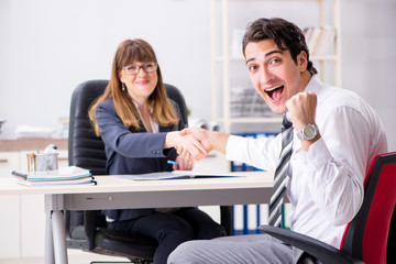 Man and woman discussing in office