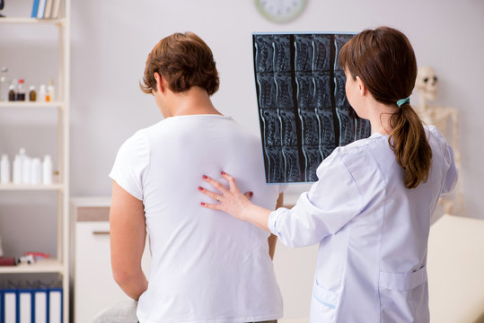 Female radiologist detecting cause of the illness  