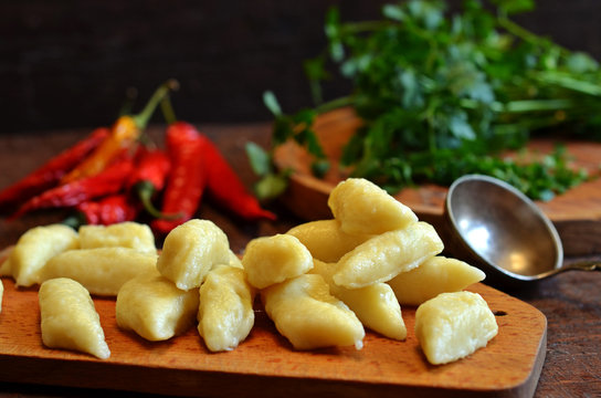 Traditional polish potato dumplings on a wooden board