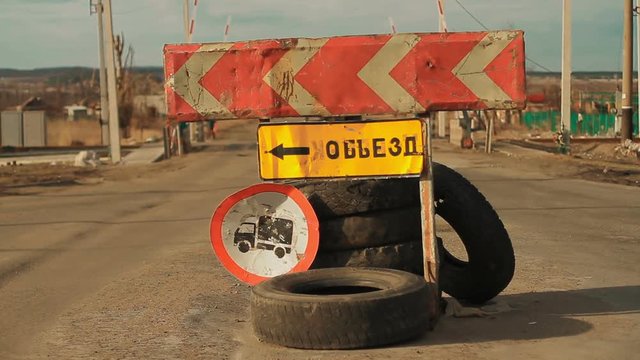 A road detour sign in ATO zone, near Donetsk, Ukraine