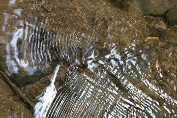 ripples on the water surface in the mountain stream